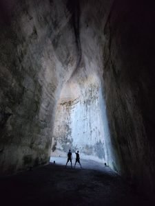 Silhouette of 2 Person inside the Cave